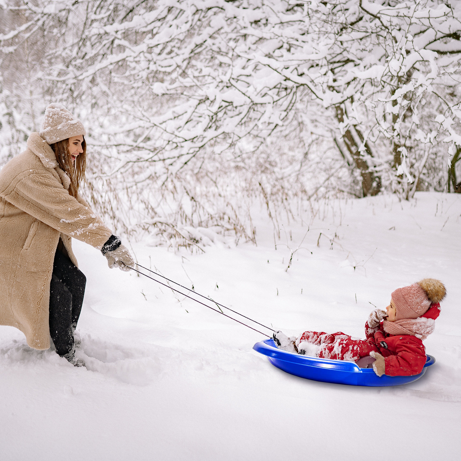 Plastic saucer sled, happy family time